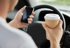 Car accident causes in Riverside have been reported to be due to distraction from texting and eating while driving.
