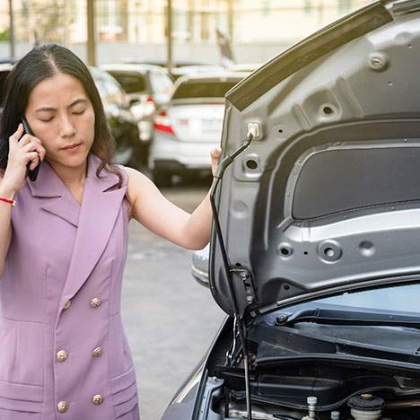 A woman calls her insurance company after a car accident.
