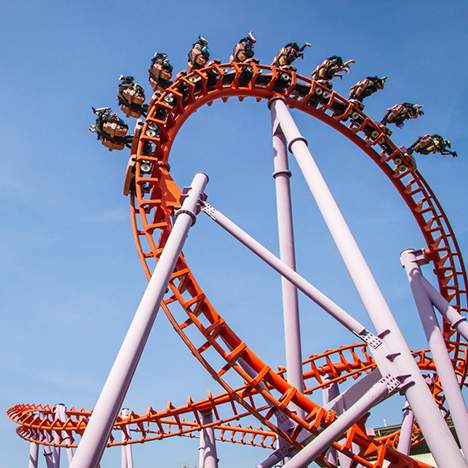 Riders on a looping rollercoaster, suggesting the question: can you sue after signing a waiver?