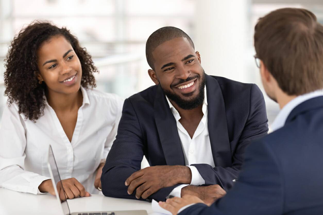 A personal injury attorney meets with potential clients in an office