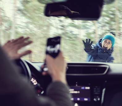 A pedestrian about to be hit by a distracted driver