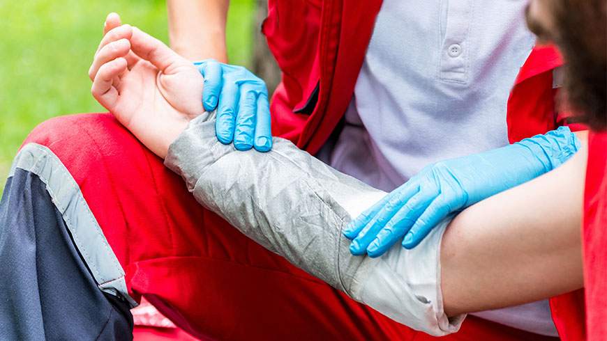 An accident victim is treated for a burn injury after an accident