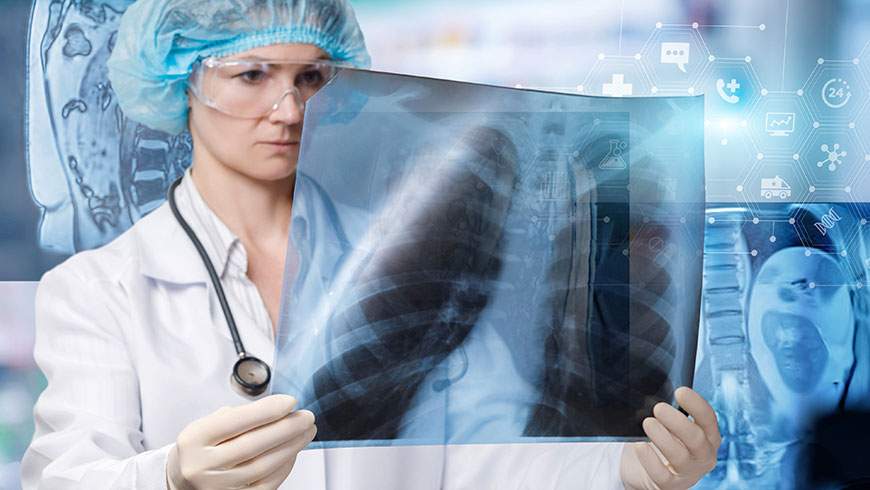 A doctor examines an x-ray image after an accident to determine internal injuries