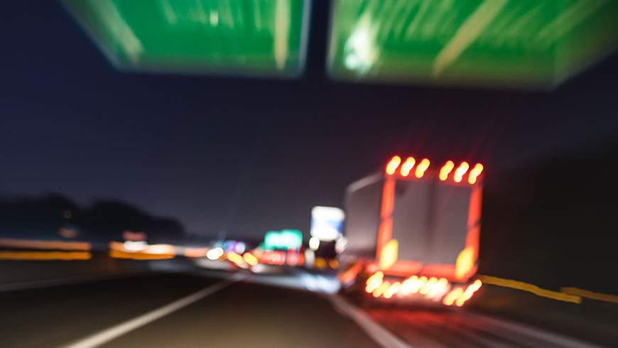 A semi-truck speeds down a highway and increases risk of a T-bone accident