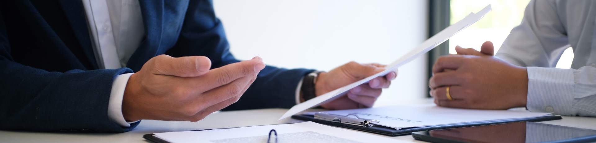 Two people reviewing information in an office setting