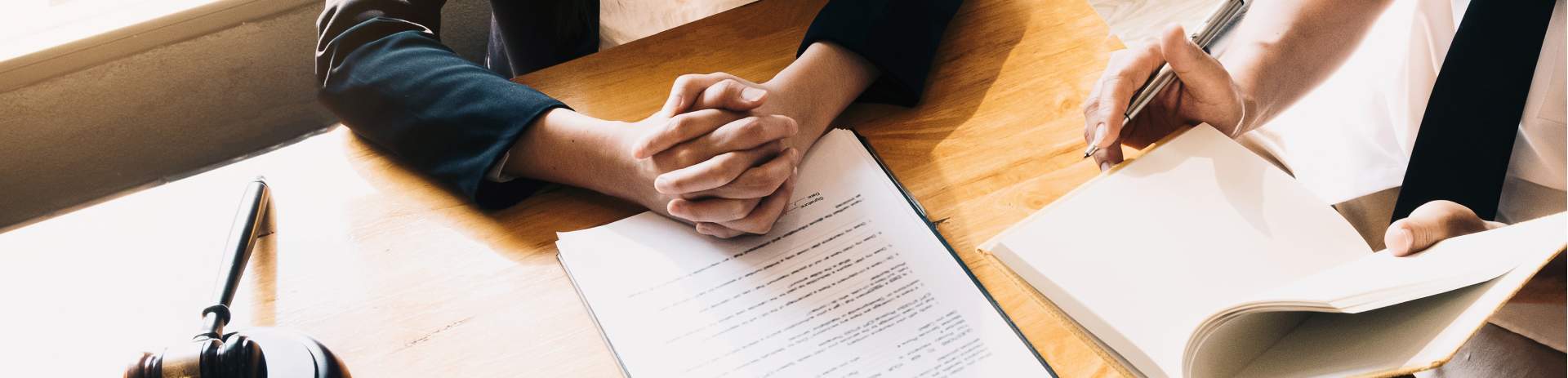 Two people comparing notes in an office setting