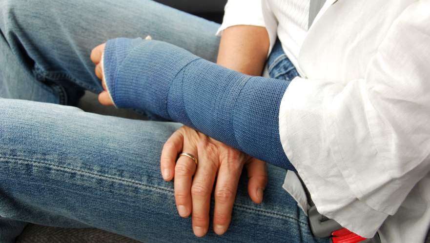 An injured person with a cast on their left arm