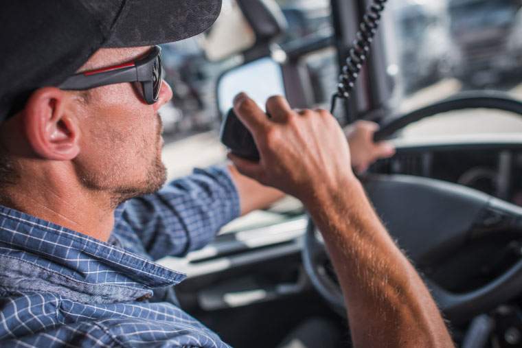 A truck driver on his radio