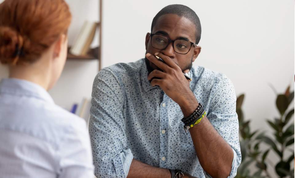 A man consulting an employment law attorney