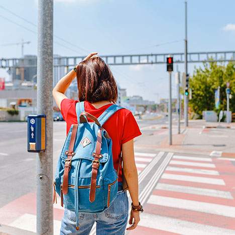 Pedestrian getting ready to safely cross the road to avoid a pedestrian car accient.