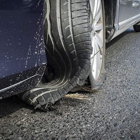 Detail of a car tire blowout - when is a tire blowout an at-fault accident?