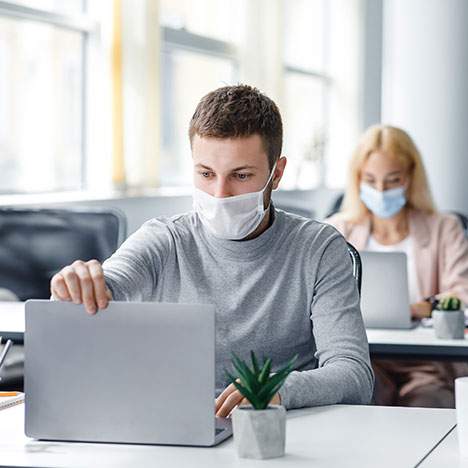 Office workers at laptops with masks - can I sue my employer for COVID?