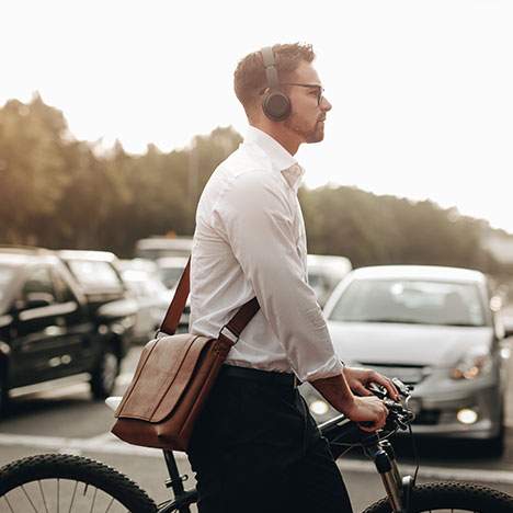 Man crossing the street in traffic - learn what to do after a San Jose pedestrian accident