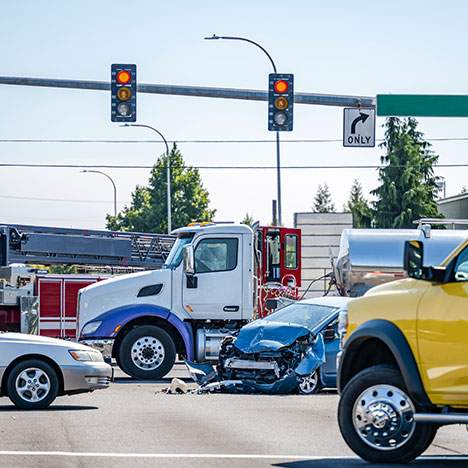 Photo of a semi-truck accident scene, prompting the query: Can I sue for being hit by a semi truck?