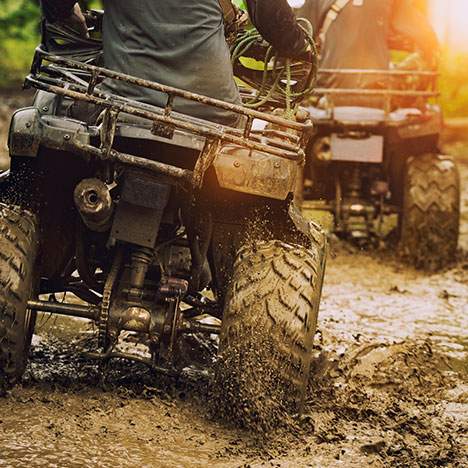 4-wheel ATV in mud - if you've been injured in a crash, find the right ATV injury lawyer