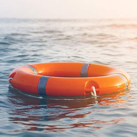life ring buoy in the middle of the water - San Diego boat accident attorney