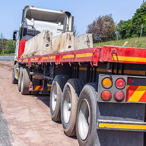 the back view of a semi truck with no load - truck and pedestrian accident