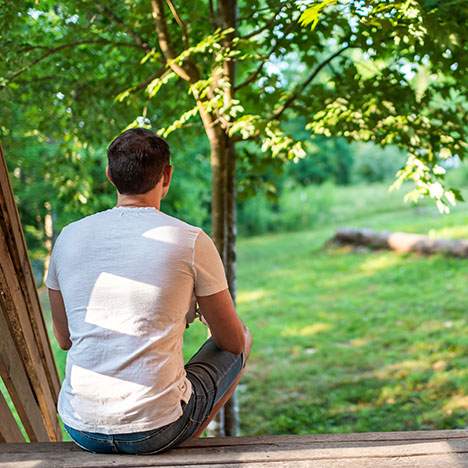 Man sitting on deck looking at the view, can I lose my house due to at-fault car accident injuries?