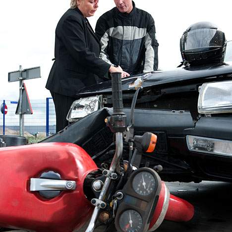 motorcycle crashed , both drivers speaking to each other