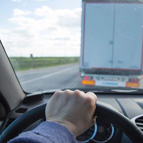 point of view of a driver behind a semi-truck