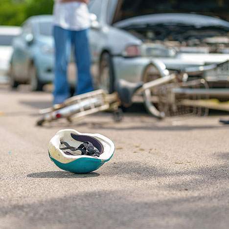 motorcycle accident with helmet on the ground