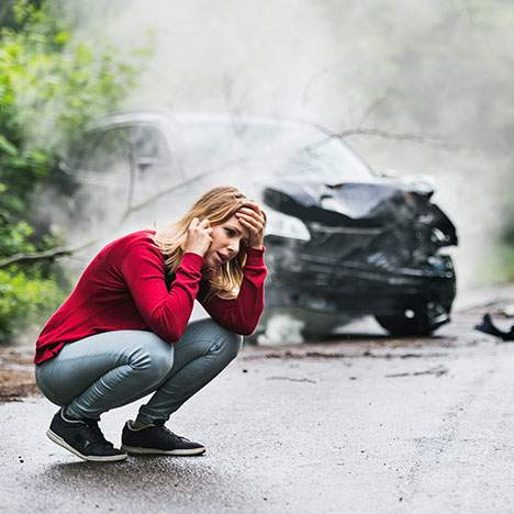 woman in front of a SUV accident