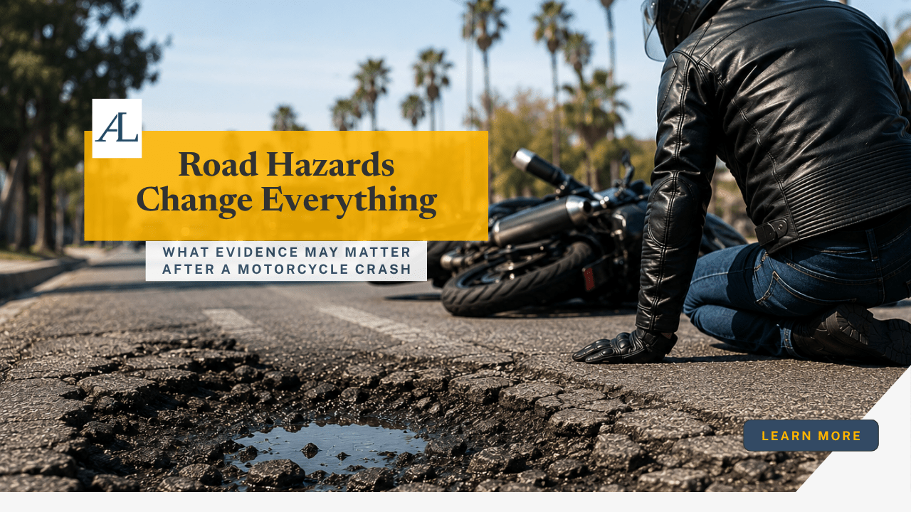 motorcyclist near damaged roadway after motorcycle accident caused by road hazard in Anaheim CA on palm-lined Southern California street